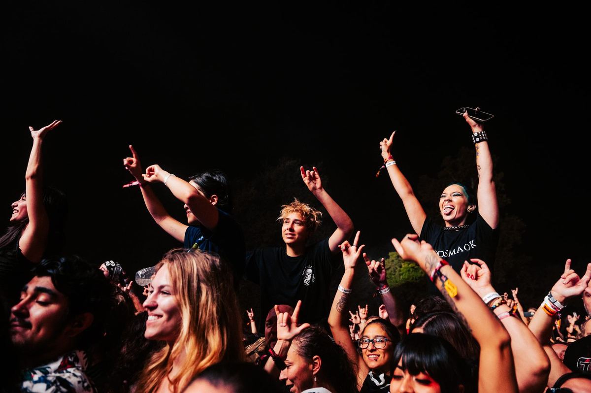 Festival at night with stage lights and crowd